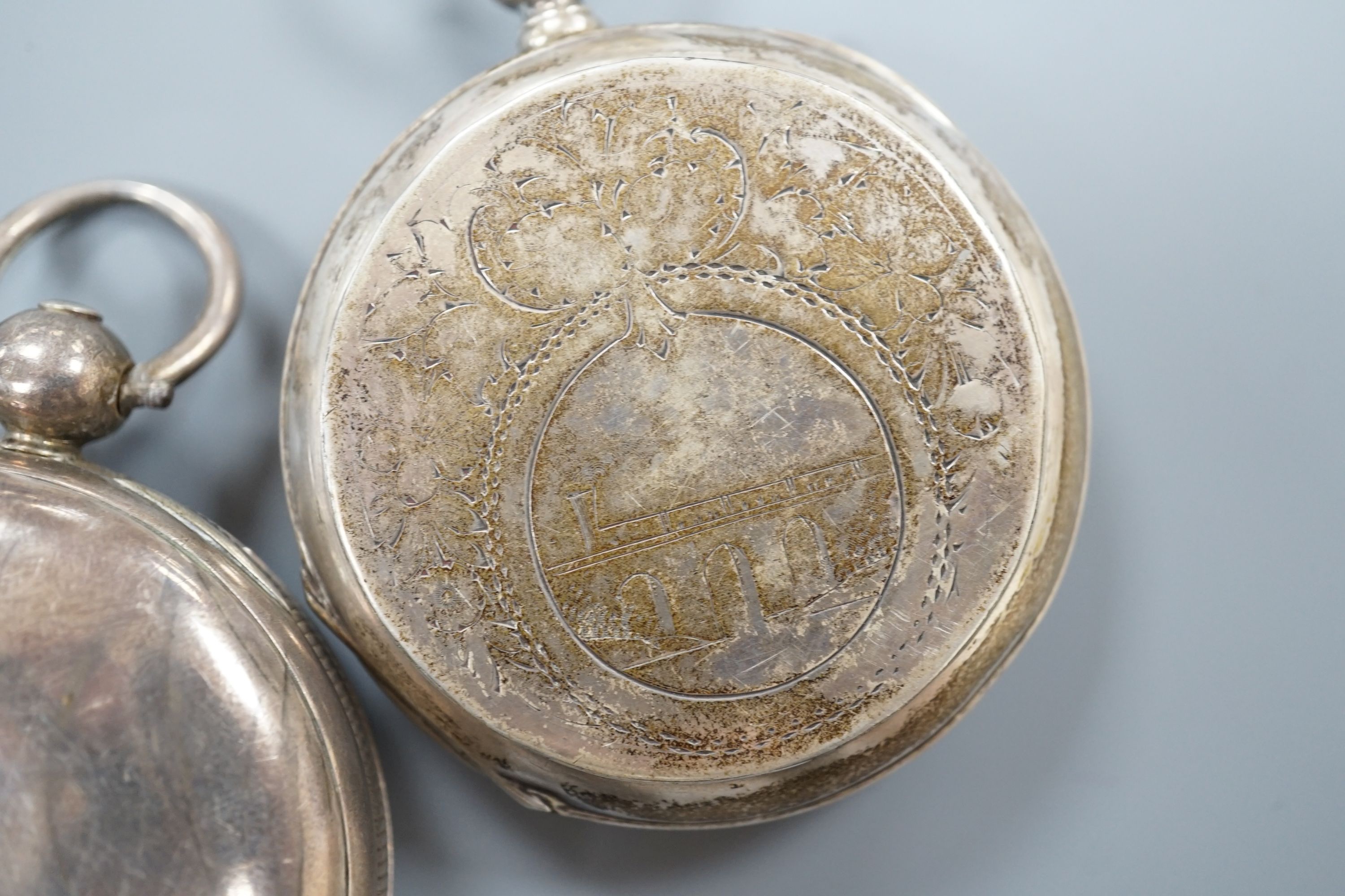 A 19th century white metal hunter pocket watch, by Robert Roskell, Liverpool, engraved with train on a bridge and one other silver hunter pocket watch.